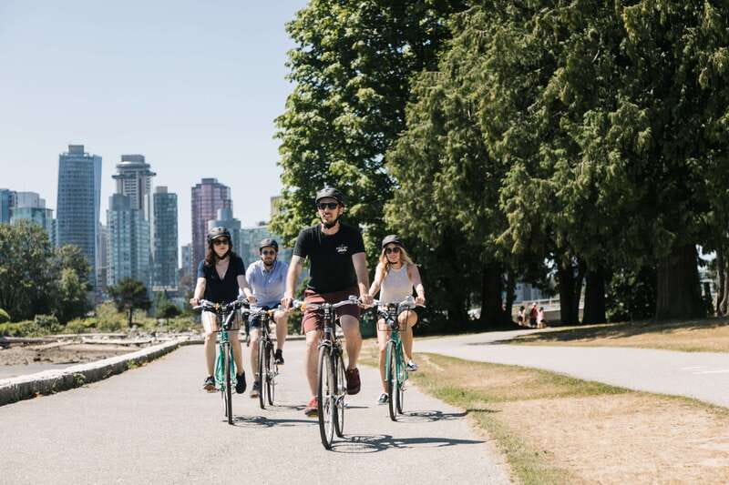 Vancouver: Stanley Park Bicycle Tour - Enter Stanley Park: rainforest trails, totem poles, and giant views